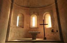 stone church with altar and cross