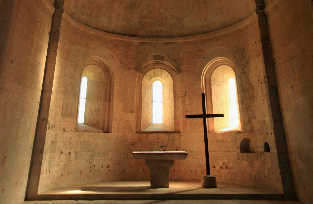 stone church with altar and cross