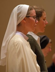 Nuns and female guest singing in choir
