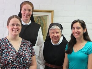 Nuns and retreatant smiling