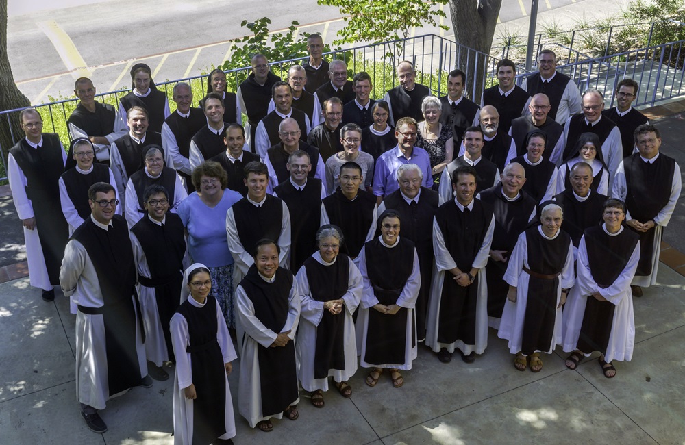 A birds eye view of Cistercian monks and nuns pose for a picture