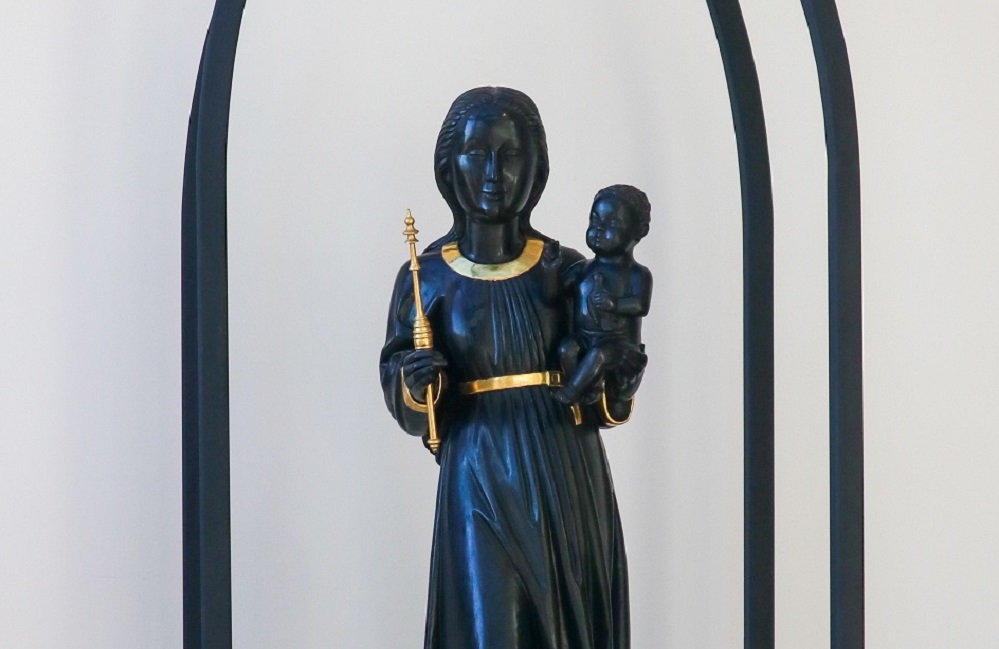Black and Gold Statue of the Blessed Virgin Mary holding the baby Jesus