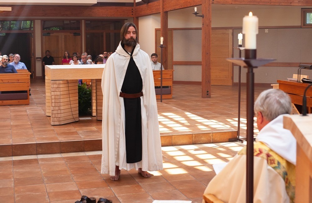 Br. Scott stands before the altar at Guadalupe Abbey