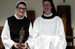 Sr. Rose Solemn Profession: Sr. Rose holding Good Shephard Statue near Mother Sofia