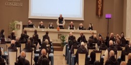 General Chapter, Dom Bernardus and others at podium in the Aula