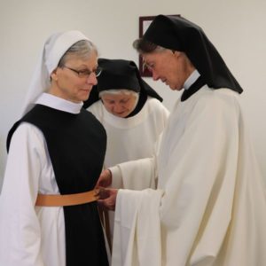 Sister Sharon receive belt and scapular of a professed Trappistine nun from Mother Victoria