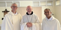 New Novices smile with abbot