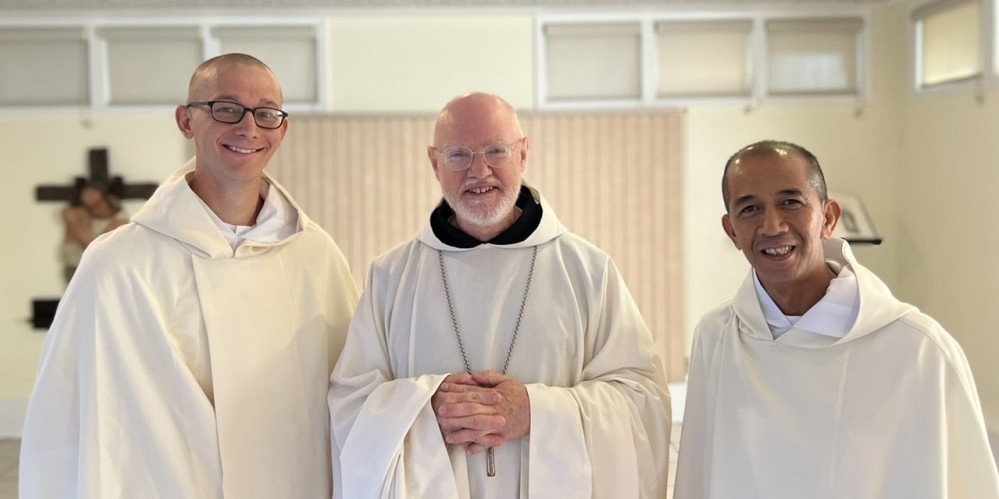 New Novices smile with abbot