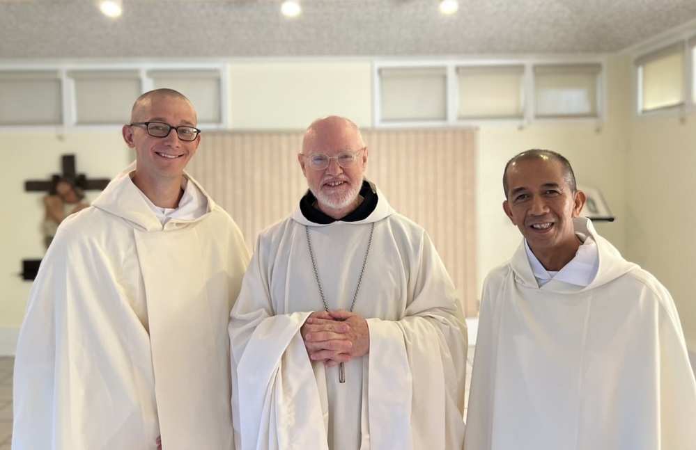 New Novices smile with abbot