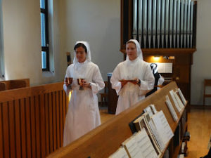 New Novices at Mississippi bring up the gifts at Mass 