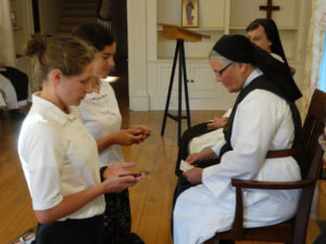 New novices at OLM prepare to receive the Cistercian Habit from Mother Rebeca