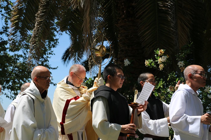 Monks in Eucharistic procession with monstrance
