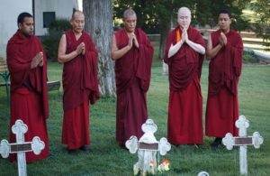 Buddhist monks pray before Thomas Merton's grave at Gethsemani Abbey