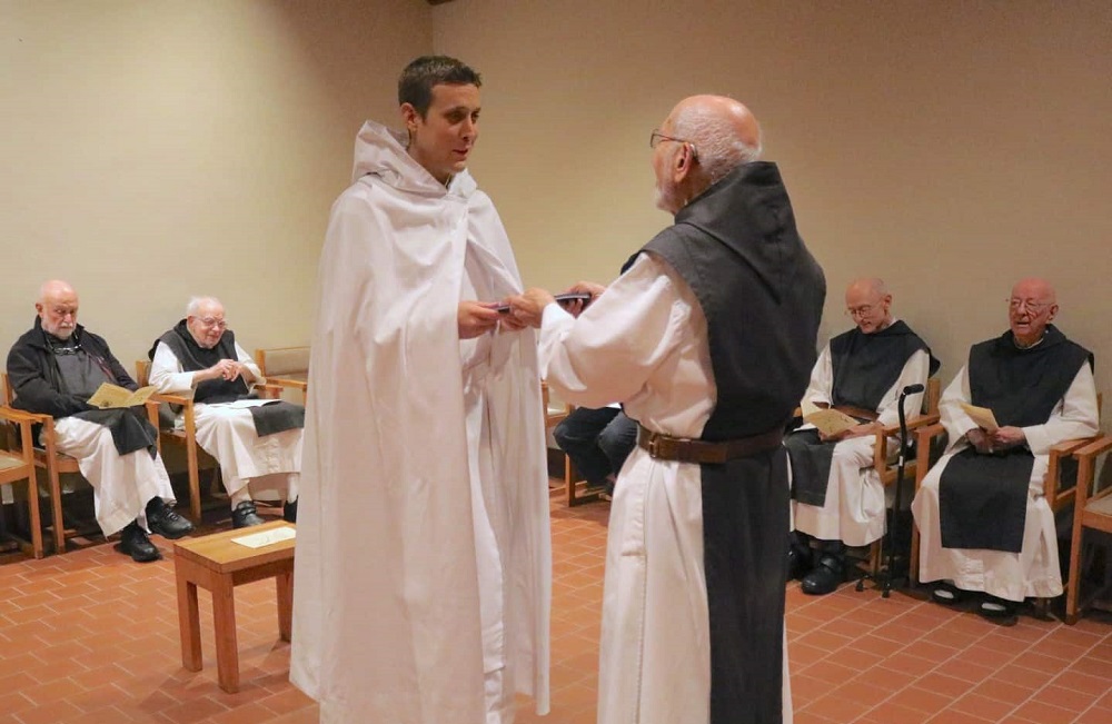 Br. Kyle of Mepkin receives Novice habit from superior Fr. Joe